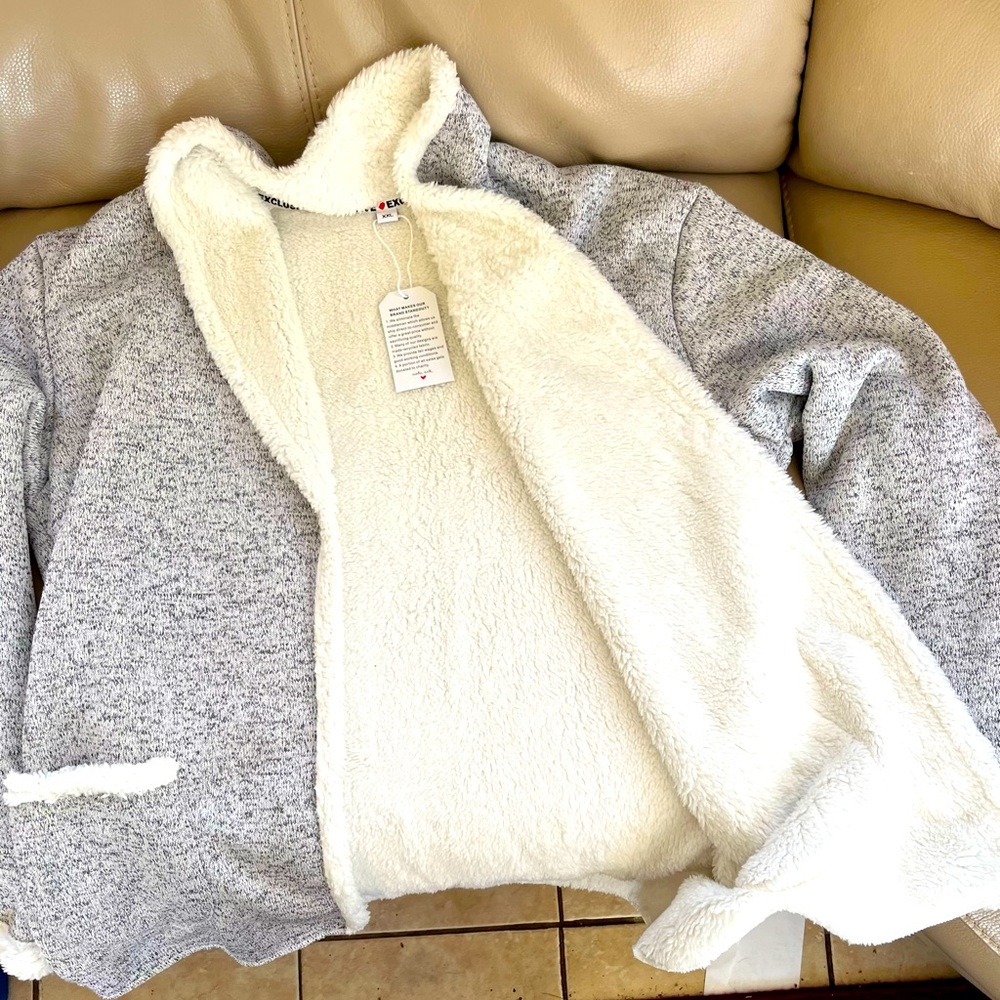 Casual, open front, grey cardigan sweater with faux fleece interior.